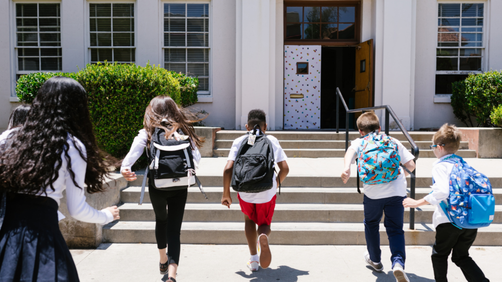 children going to school with an attached allergy alert backpack tag
